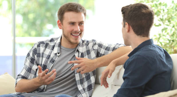 Two friends talking at home